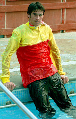 pool lifeguard swimming in uniform clothes